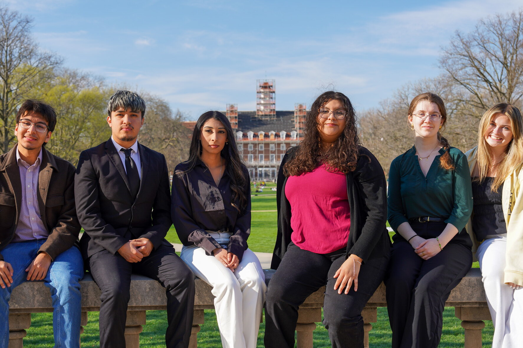 Students sitting on a ledge